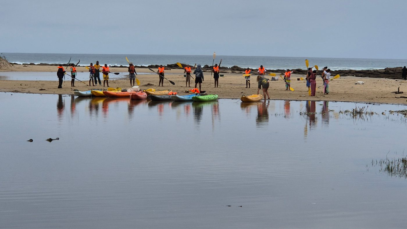 School group with canoes at the Nahoon River mouth