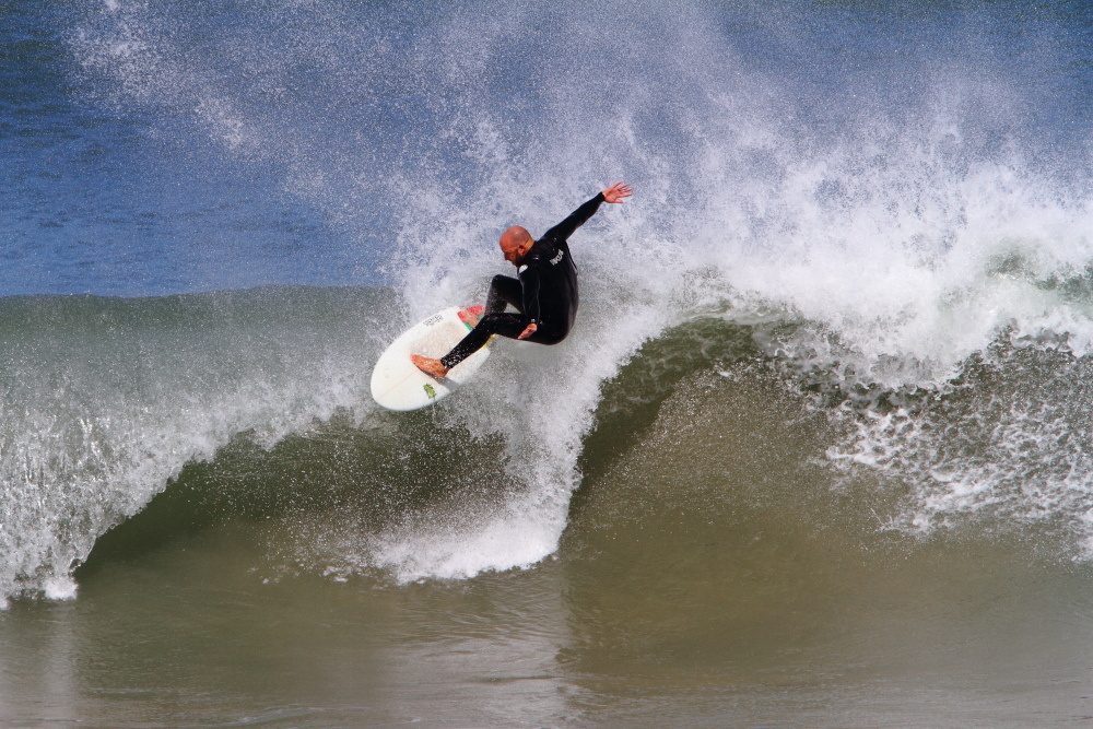 Surfer carving a wave at Nahoon Reef