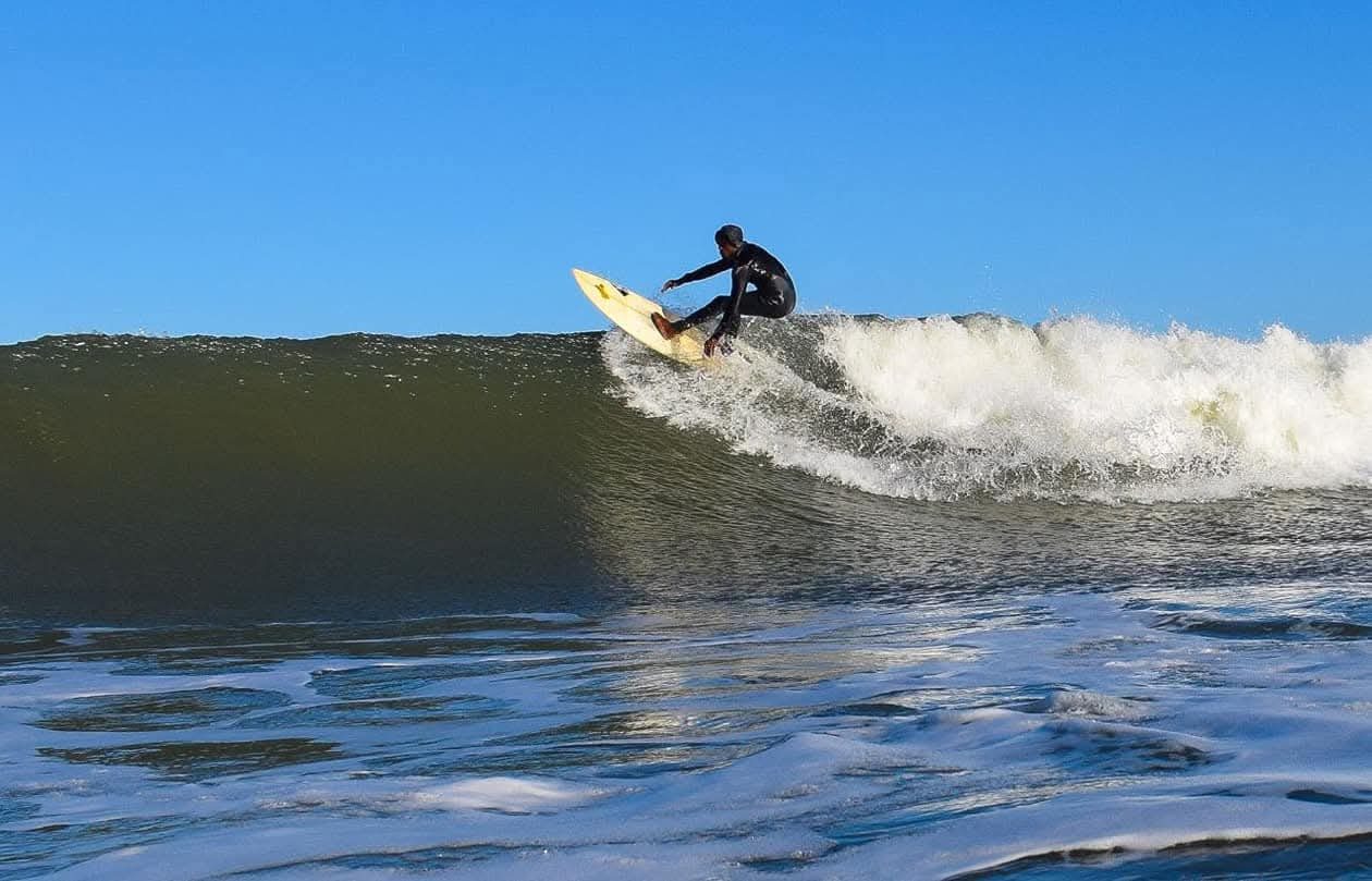 Surfer riding a green wave at Nahoon